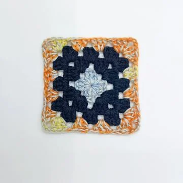 Handmade crochet coaster square pattern Stock Photos