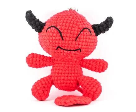 Handmade crochet red devil doll on white background Stock Photos