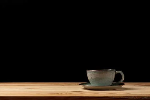 Handmade cup with coffee on the table Stock Photos