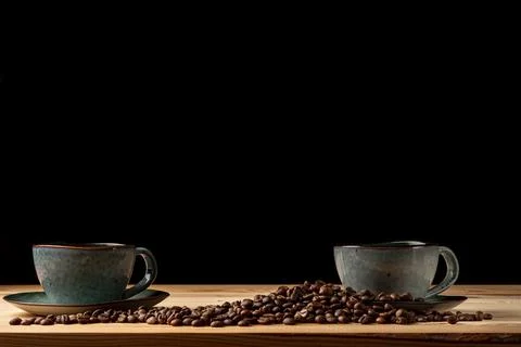 Handmade cup with coffee on the table Stock Photos