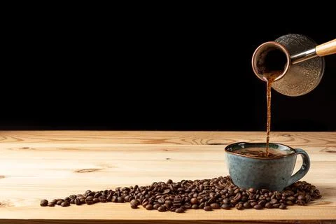 Handmade cup with coffee on the table Foto stock