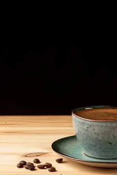 Handmade cup with coffee on the table Stock Photos