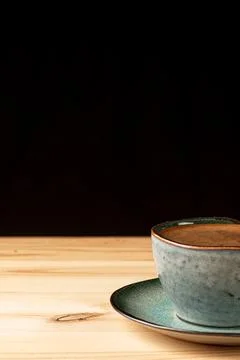 Handmade cup with coffee on the table Stock Photos