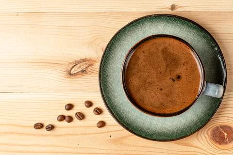 Handmade cup with coffee on the table Stock Photos