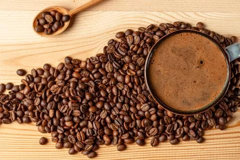 Handmade cup with coffee on the table Stock Photos