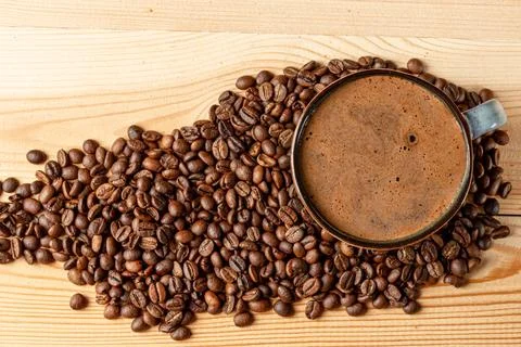 Handmade cup with coffee on the table Stock Photos