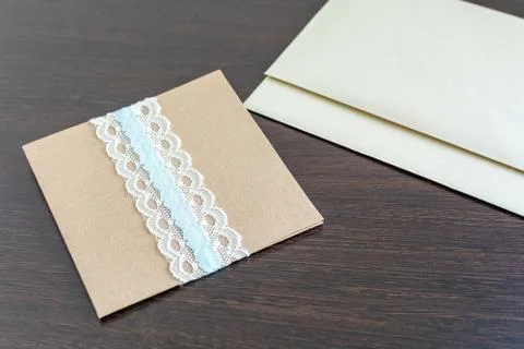 Handmade decorative envelope with two empty paper sheets Stock Photos