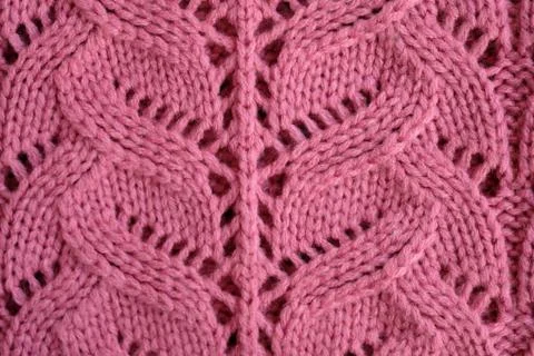 Handmade delicate pink openwork knitting. Knitted sweater in pink. The textur Stock Photos