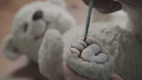 Handmade. Details of teddy bear. Rare collectible toy is a teddy bear Stock Footage