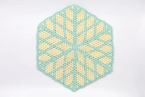 Handmade Diamond Pattern Knitted Mat in Mint Green and Cream Stock Photos