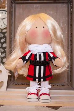 Handmade doll in the interior. Stock Photos