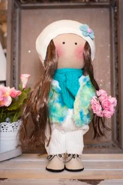 Handmade doll in the interior. Stock Photos
