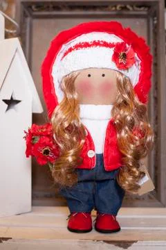Handmade doll in the interior. Stock Photos
