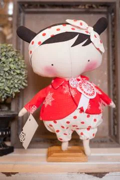 Handmade doll in the interior. Stock Photos