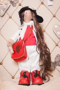 Handmade doll in the interior. Stock Photos