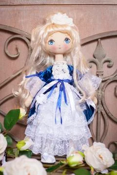 Handmade doll in the interior. Stock Photos