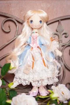 Handmade doll in the interior. Stock Photos