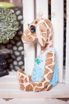 Handmade doll in the interior. Stock Photos