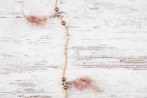 Handmade dream catcher with feathers threads and beads rope hanging on a ligh Stock Photos