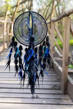 Handmade dream catcher with feathers threads and beads rope hanging Stock Photos