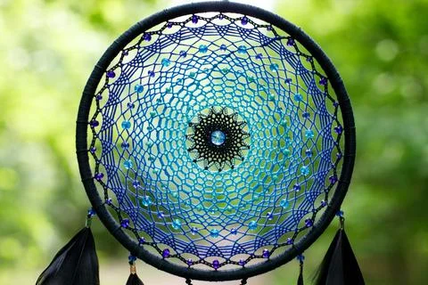 Handmade dream catcher with feathers threads and beads rope hanging Stock Photos