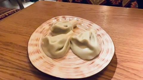 Handmade Dumplings On Wooden Table, Five Pleated Khinkali Arranged On Ceramic Stock Footage 325233584