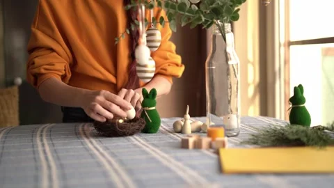 Handmade Easter decorations on table in warm sunlight Stock Footage 329118661