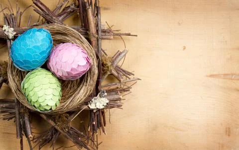 Handmade easter eggs in a nest Stock Photos