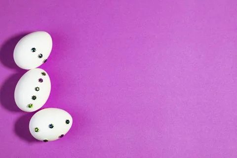 Handmade Easter Eggs on Purple Background for Spring Decor Stock Photos