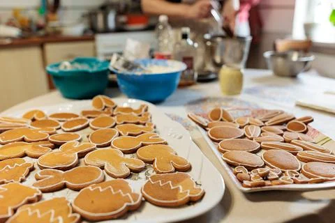 Handmade Easter gingerbread cookies in white plate on dark table.Spring symbo Stock Photos