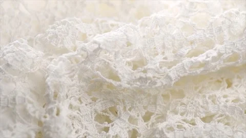 Handmade embroidered lace close-up, rotating background, top view, vintage	 Stock Footage 339511166