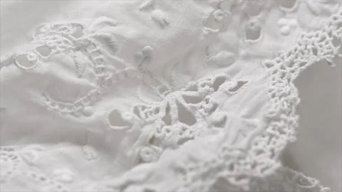 Handmade embroidered lace close-up, rotating background, top view, vintage Stock Footage 342845260