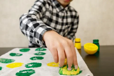 Handmade exclusive print pattern. diy Printing Stamps lemons on clothes. step-by Stock Photos