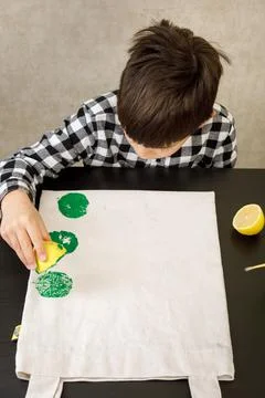 Handmade exclusive print pattern. diy Printing Stamps lemons on clothes. step-by Stock Photos