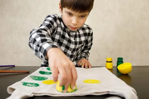 Handmade exclusive print pattern. diy Printing Stamps lemons on clothes. step-by Stock Photos