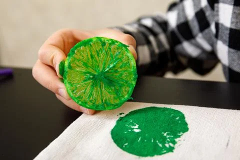 Handmade exclusive print pattern. diy Printing Stamps lemons on clothes. step-by Stock Photos