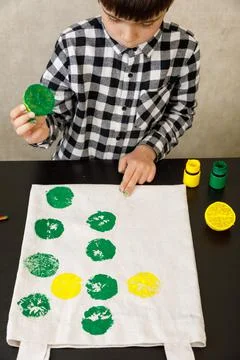 Handmade exclusive print pattern. diy Printing Stamps lemons on clothes. step-by Stock Photos