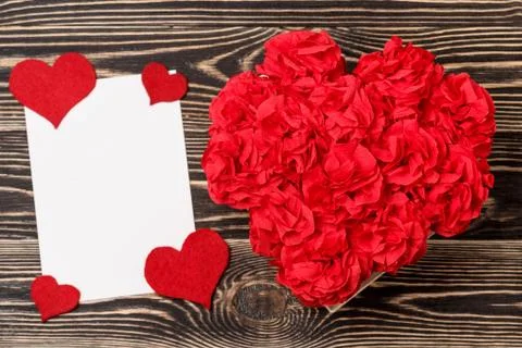 Handmade flowers in box with valentine card on brown backdrop Stock Photos