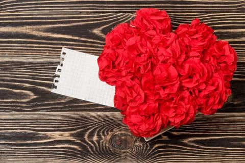 Handmade flowers with valentine card on brown Stock Photos