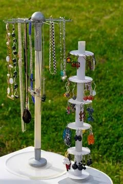 Handmade Gemstone Necklaces and Dangle Earrings on Rotating Display Stands Stock Photos