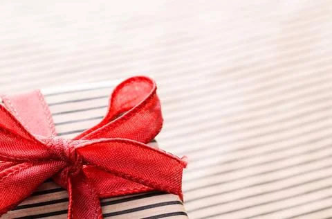 Handmade gift box Handmade gift box wrapped with craft paper and red bow C... Stock Photos