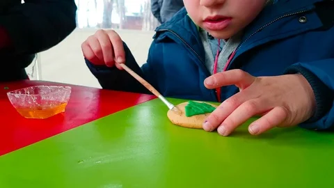 Handmade Ginger Biscuits, Kid Decorating Christmas Cookies Stock Footage 83518167