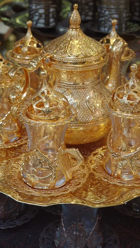 Handmade gold tea set on display in a market Stock Footage 342211093