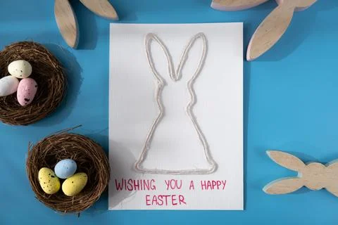 Handmade greeting card with EASTER bunny HAPPY EASTER written in beautiful Stock Photos