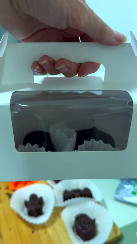 Handmade halloween chocolates packed in gift box with clear window. Cute spooky Stock Footage 343478040