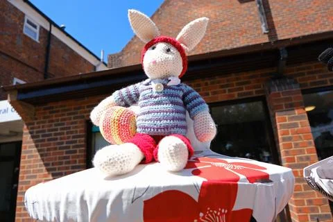 Handmade Knitted Rabbit Postbox Topper on Sunny Day Stock Photos