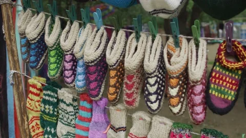 Handmade knitted shoes Stock Footage 138159473
