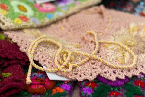 Handmade knitted textiles with bright patterns Foto stock