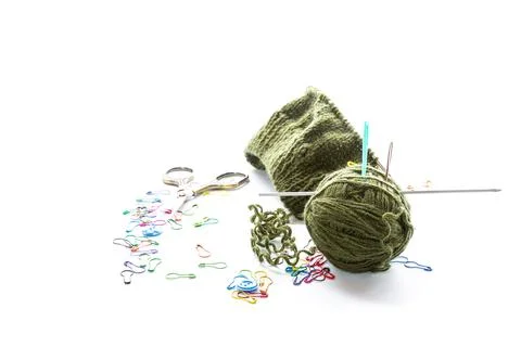 Handmade knitting workspace with yarn scissors and accessories Stock Photos