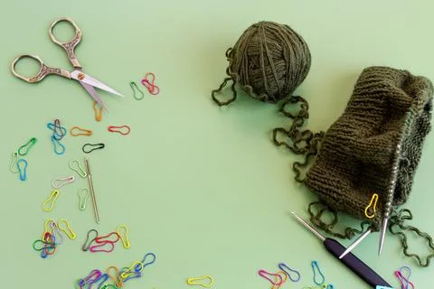 Handmade knitting workspace with yarn scissors and crochet tools Stock Photos